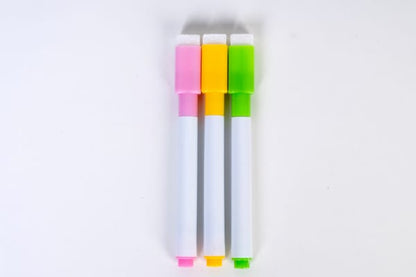 Three write-and-wipe markers with pink, yellow, and green tips