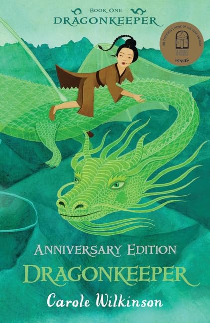 Dragonkeeper anniversary edition book cover with green dragon and rider, illustrated
