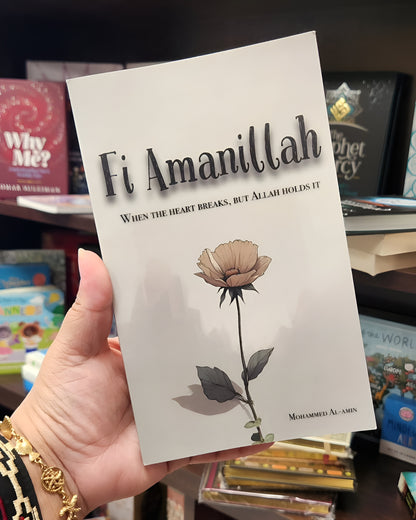 Hardcover book with white cover, lotus flower illustration and printed title text